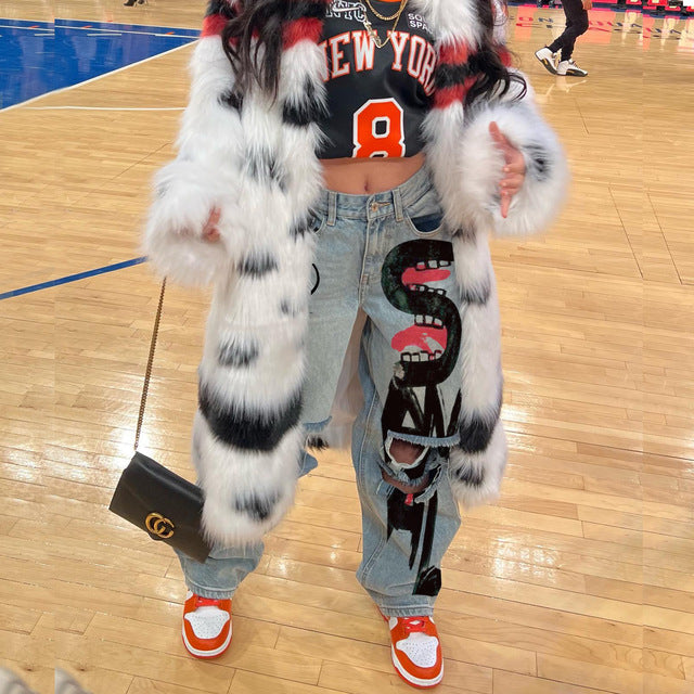 High-waisted printed denim pants with smiling faces