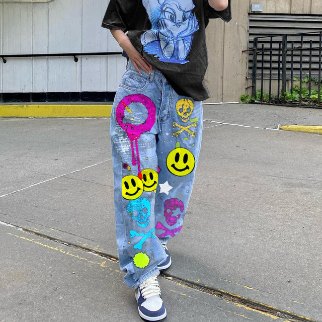 High-waisted printed denim pants with smiling faces