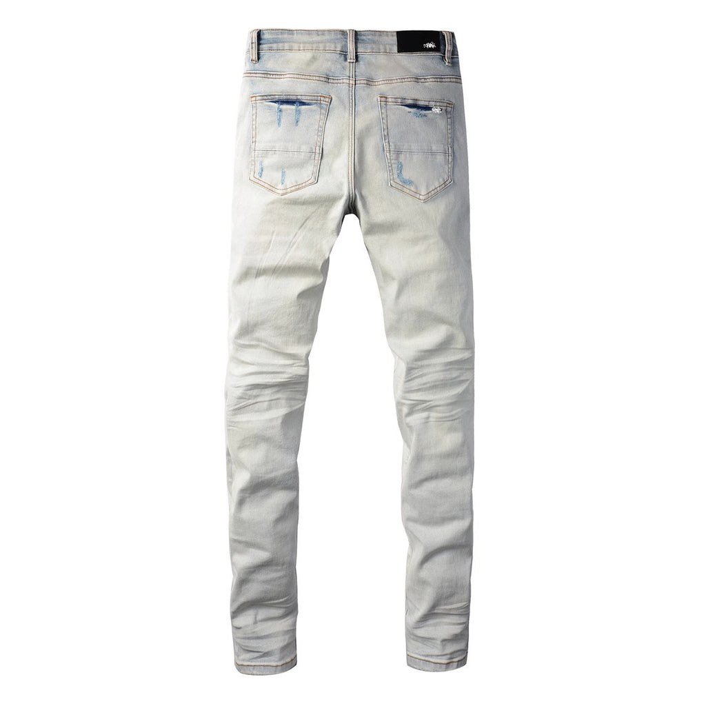 Distressed red patched jeans