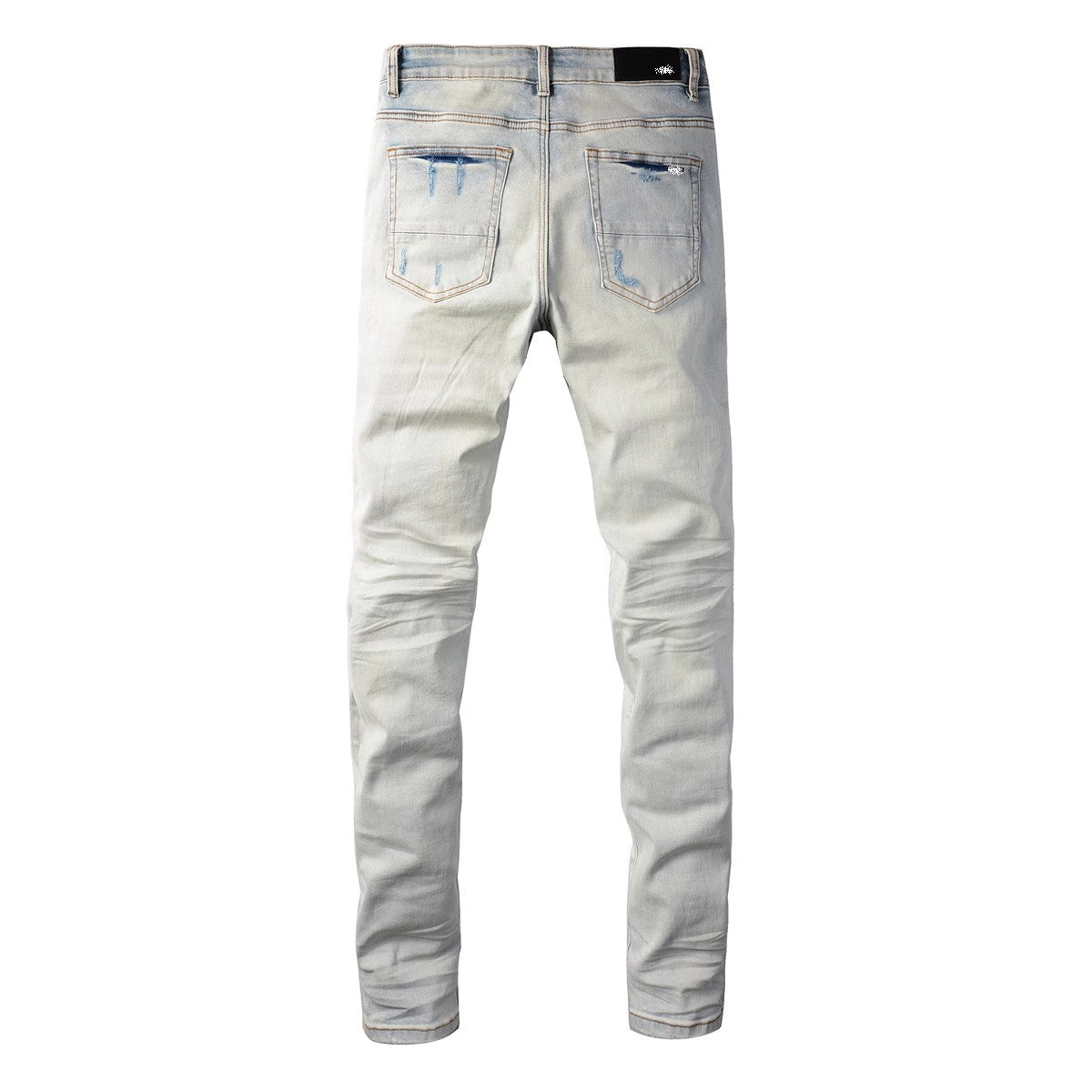 Distressed red patched jeans