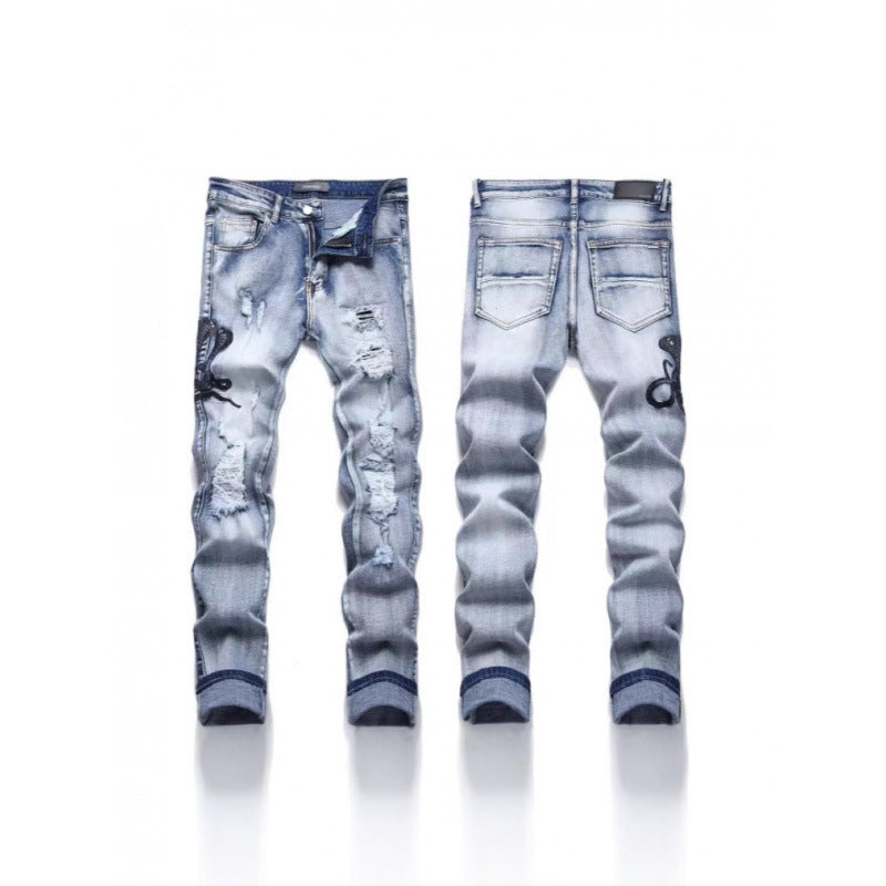 Amiri Straight-leg patchwork embroidered jeans