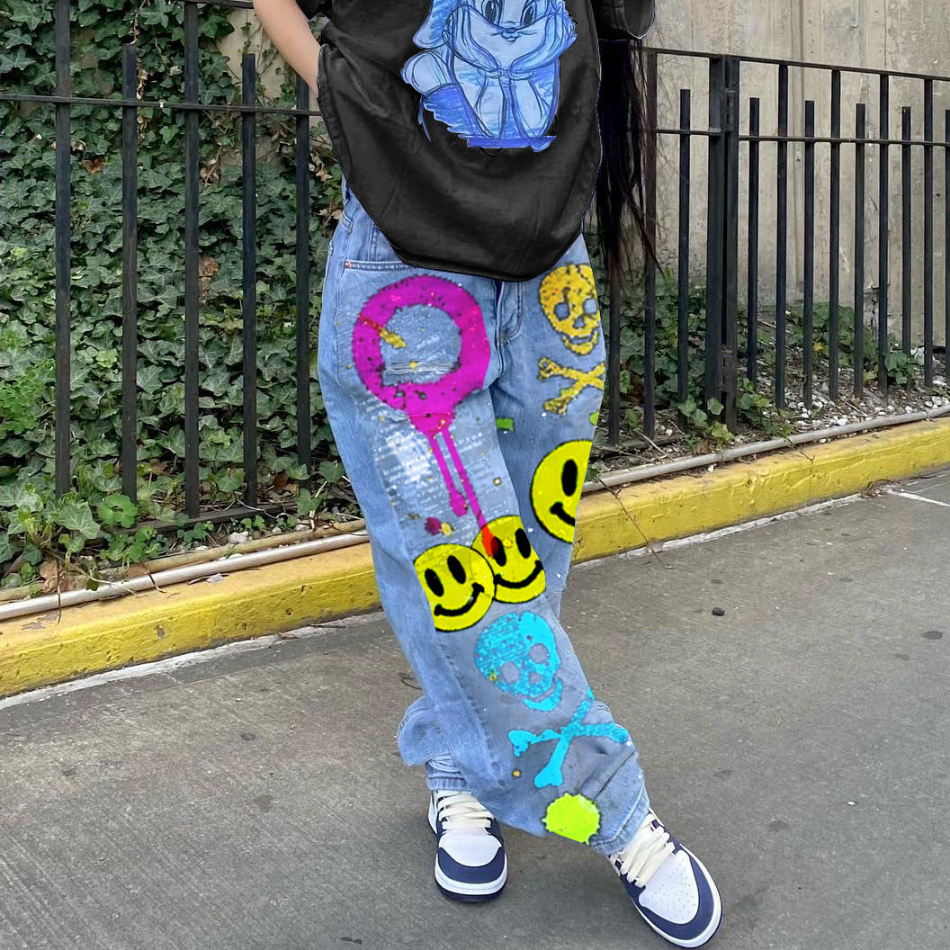 High-waisted printed denim pants with smiling faces