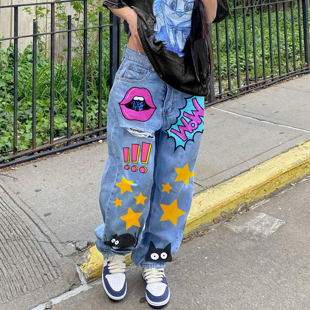 High-waisted printed denim pants with smiling faces