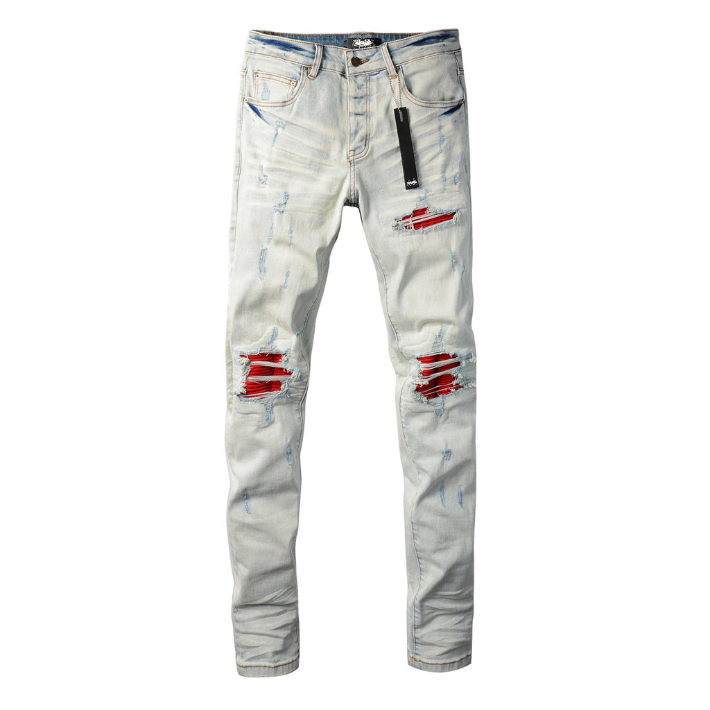 Distressed red patched jeans