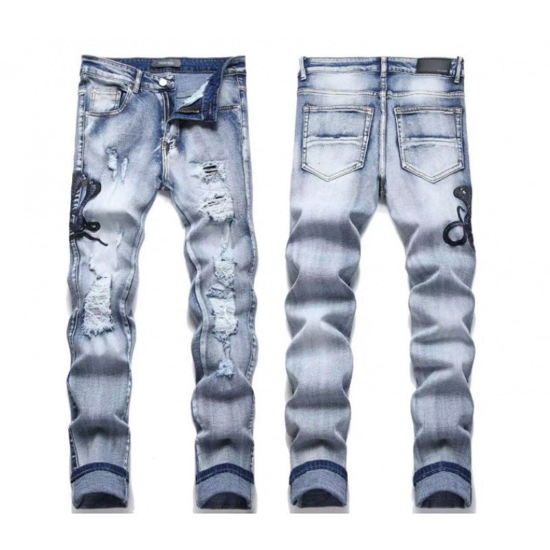 Amiri Straight-leg patchwork embroidered jeans