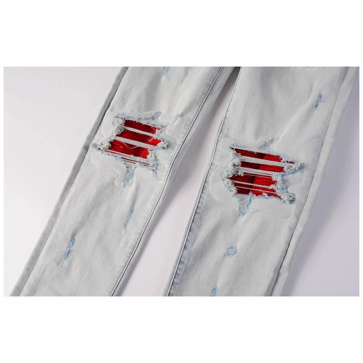 Distressed red patched jeans