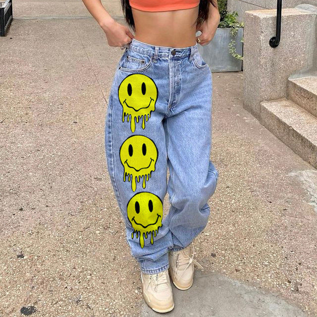 High-waisted printed denim pants with smiling faces