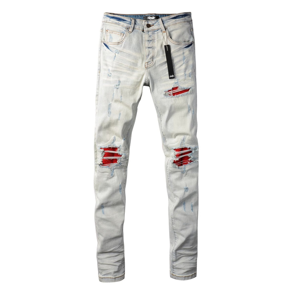 Distressed red patched jeans