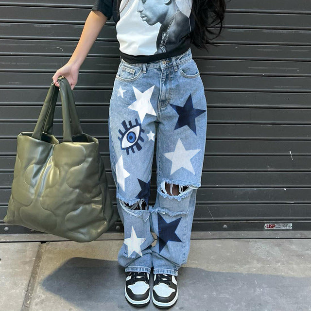 High-waisted printed denim pants with smiling faces