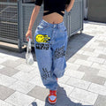 High-waisted printed denim pants with smiling faces